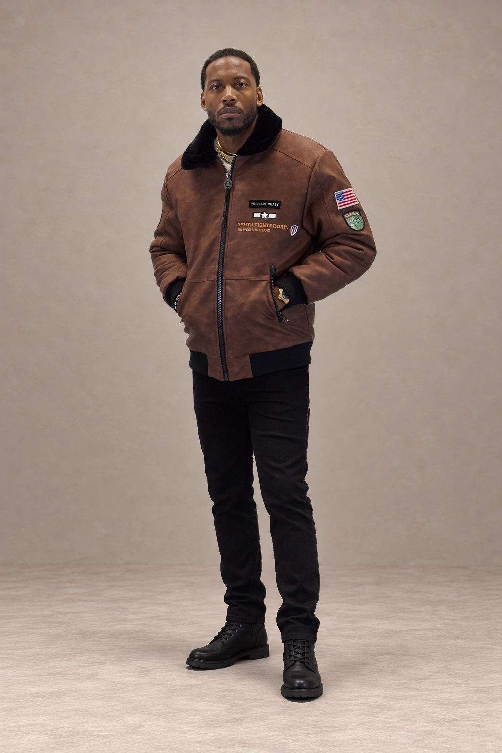 Brown Aviator Bomber, front-led full-length studio composition on a Warm taupe set